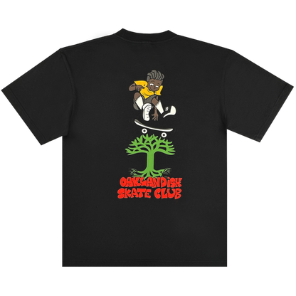 The Oaklandish Skate Club Tee by Oaklandish is a black classic-fit t-shirt featuring a cartoon skater in a yellow shirt leaping over a green tree, with bold red "OAKLANDISH SKATE CLUB" text below, capturing skateboard culture.