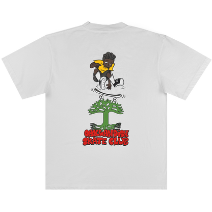 The Oaklandish Skate Club Tee by Oaklandish features a cartoon skater with dark skin, yellow shirt, and black shorts above a green frog face, with bold red "Oaklandish Skate Club" text below, celebrating skateboarding culture.