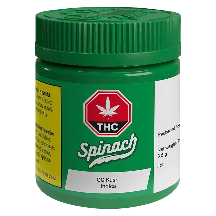 Angled front view of the green Spinach OG Kush jar with a red THC emblem and white product label visible.