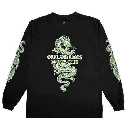 The ORSC Ryujin LS Tee by Oakland Roots SC is a black long-sleeve shirt with a bold neon-green dragon wrapped around “Oakland Roots Sports Club” on the chest and smaller dragon accents on the sleeves, shown laid flat on a white background.