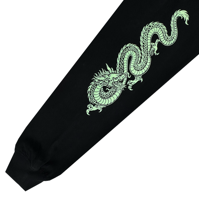 The Oakland Roots SC ORSC Ryujin LS Tee showcases a detailed, coiled light green dragon graphic on a black sleeve inspired by Asian art, finishing with a ribbed cuff for a bold tribute to club style.