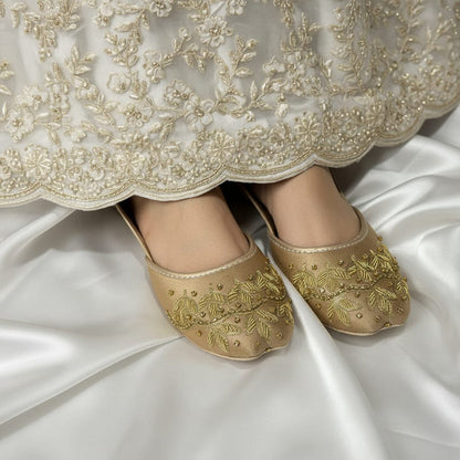 Traditional Pakistani jutti available in purple, black, and gold colors