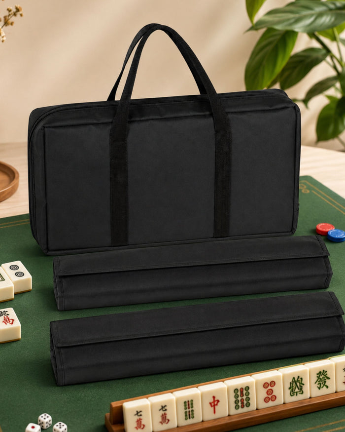 Black mahjong carry bag with two tile rack case sleeves stacked for storage