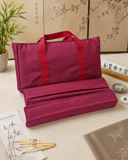 Red mahjong carry bag with two tile and rack cases, folded open
