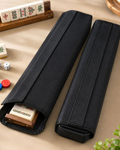 Two black mahjong tile rack case sleeves with open tops and padded sides