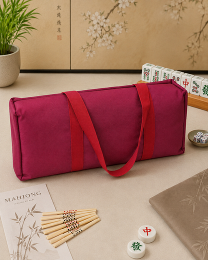 Red mahjong carry bag with two tile-and-rack cases and long carrying strap