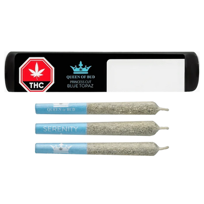 Top-down view of three blue-tipped pre-rolls and a black tray labeled "Princess Cut Blue Topaz Infused PR 3 x 0.5 g"