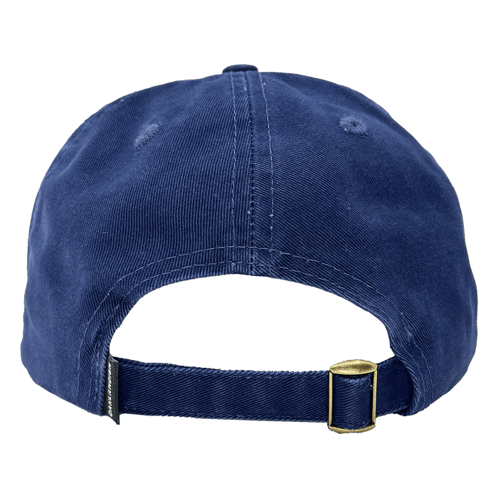 The image shows the back view of the Regal Crest Dad Hat by Oaklandish. This navy blue, 100% cotton cap features an adjustable strap with a brass-colored metal clasp for size adjustment and has two small ventilation holes on each side near the top.