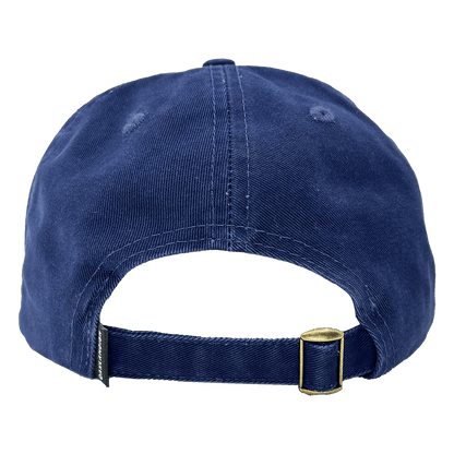 The image shows the back view of the Regal Crest Dad Hat by Oaklandish. This navy blue, 100% cotton cap features an adjustable strap with a brass-colored metal clasp for size adjustment and has two small ventilation holes on each side near the top.