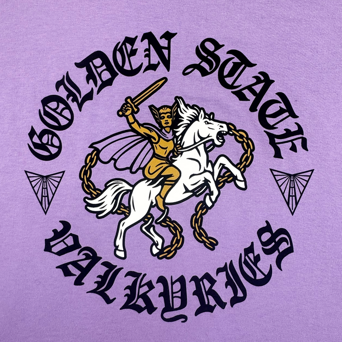 A gold-armored valkyrie on a chained white horse holds a sword aloft. “GOLDEN STATE VALKYRIES” in bold black medieval font and two geometric winged icons decorate this purple, 100% cotton ROTV Tee from GSV in a classic fit.