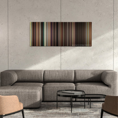 Ruby Sparks color palette canvas on a concrete wall above a gray sectional sofa