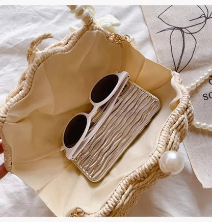 Grace Beauty shell-shaped raffia clutch handbag with woven design and pearl detail, crossbody shoulder bag.