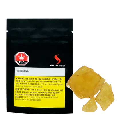 Close-up of golden-amber Slurricane Shatter, displayed against a black background with warning text and branding.