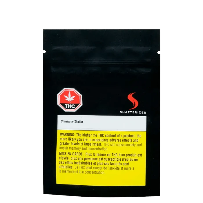 Front view of Slurricane Shatter packaging with a warning label and THC logo on a dark background.