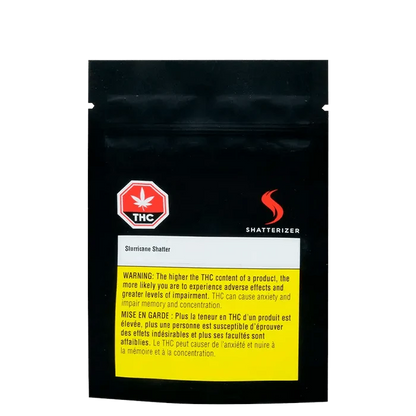 Front view of Slurricane Shatter packaging with a warning label and THC logo on a dark background.