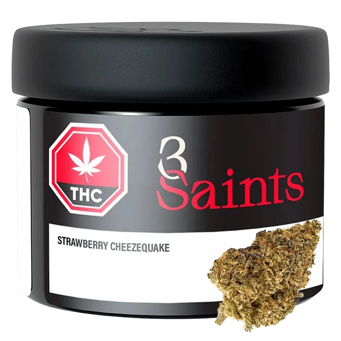 Front-facing shot of the 3 Saints Strawberry Cheezequake 7 g black jar with red logo and a cannabis bud shown at the lower right.