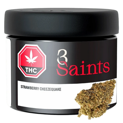 Front-facing shot of the 3 Saints Strawberry Cheezequake 7 g black jar with red logo and a cannabis bud shown at the lower right.