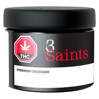 Close-up front view of the 3 Saints Strawberry Cheezequake jar against a white background, showing the black lid, THC symbol, and red logo.
