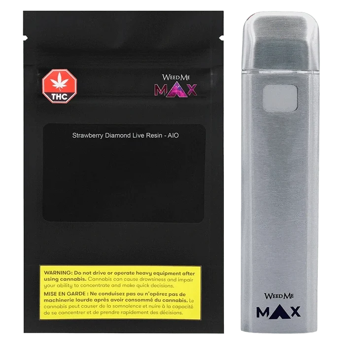 Front-facing shot of the Strawberry Cough Diamond Live Resin AIO Disposable Vape with its black resealable pouch on the left and a silver vape pen standing upright on the right.