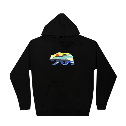 The Sunset Bear Hoodie from Never Elsewhere showcases a minimalist graphic of a California grizzly bear filled with a vibrant landscape pattern featuring a setting sun, mountains, water, and forests in hues of yellow, green, blue, and red. This black men's pullover hoodie includes a front pocket and drawstrings.
