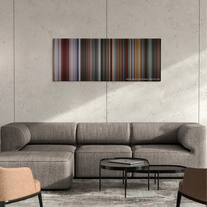 That Awkward Moment color palette canvas on a concrete wall above a gray sectional sofa