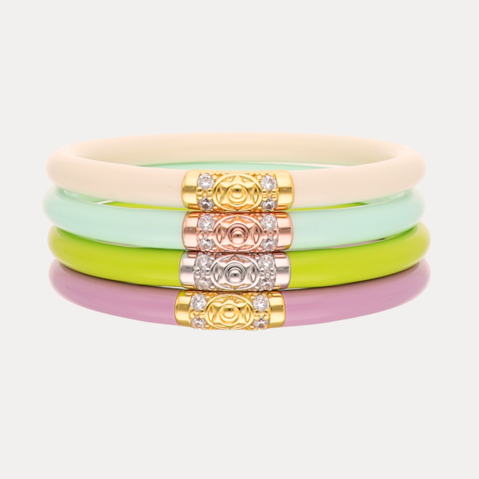 a stack of colorful bracelets