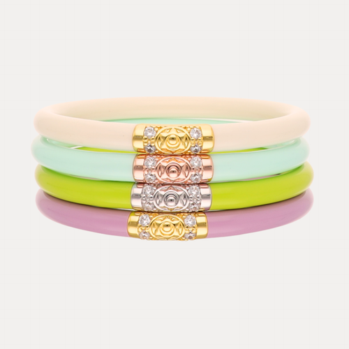 a stack of colorful bracelets