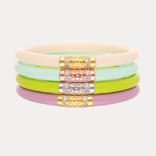 a stack of colorful bracelets