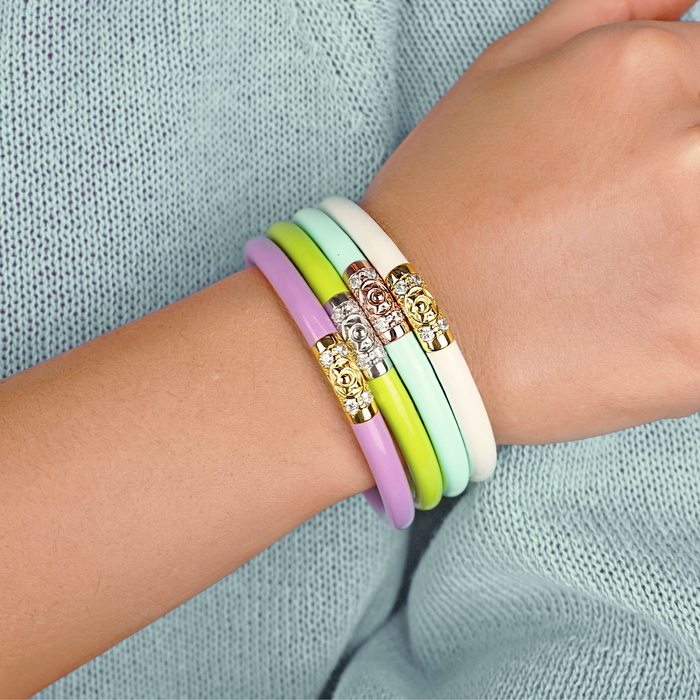 a person wearing bracelets on their wrist