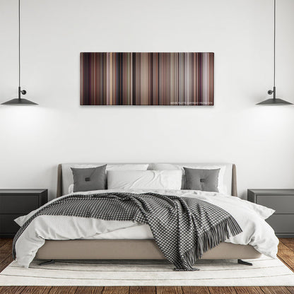 The Man with the Golden Gun color palette canvas above a bed, between two black pendant lamps