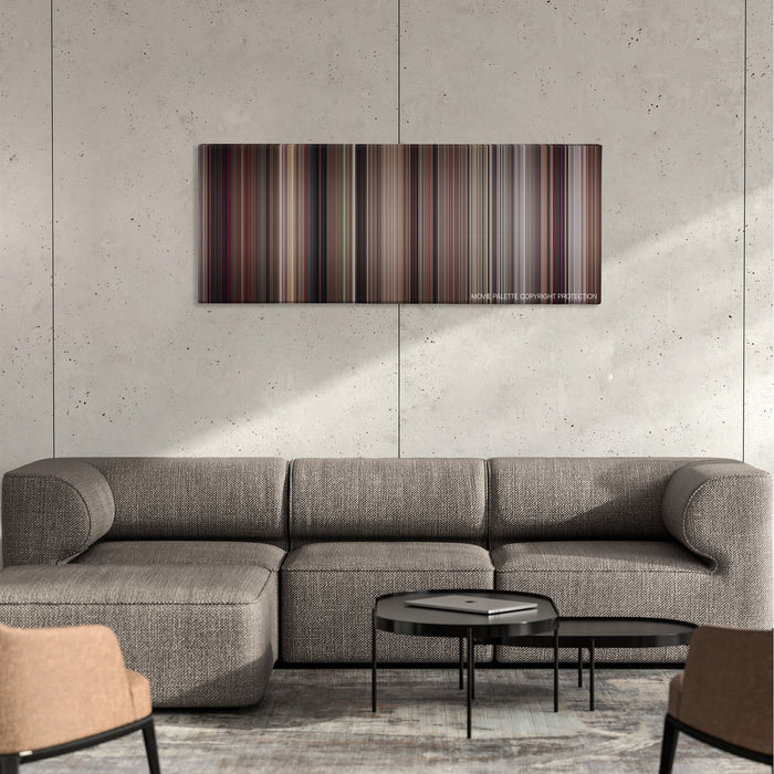 The Man with the Golden Gun color palette canvas on a concrete wall above a gray sectional sofa