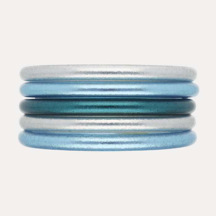 The Teal Tidal Stack featuring shimmering Silver All Weather Bangles® and vibrant Azure AWB®.