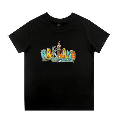 The Oaklandish Toddler Blockletters Tee is a black shirt with "OAKLAND" in big, colorful letters on the chest, each filled with city landmarks. Available in toddler sizes.