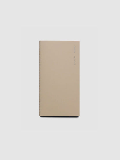 Travel Notebook in size Pocket Plus in color Ibiza with Goal Tracking pages shown closed.