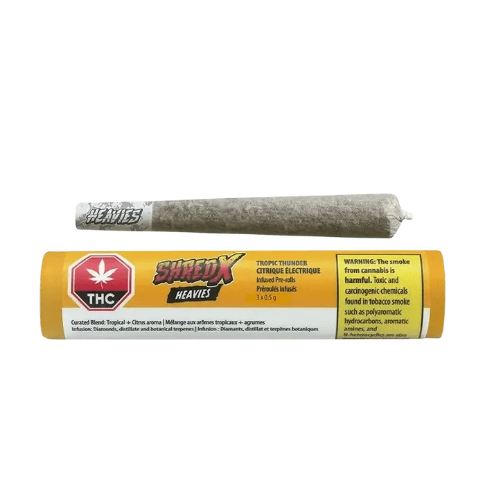 Front view of the Tropic Thunder Heavies Infused Pre Rolled packaging, displaying bold branding with a dark background and vibrant text.