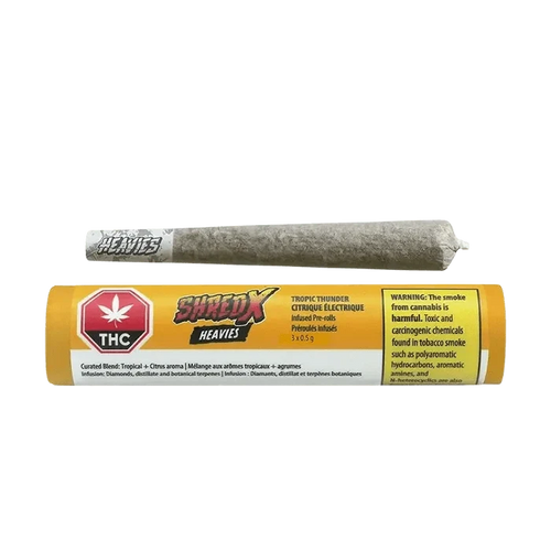 Front view of the Tropic Thunder Heavies Infused Pre Rolled packaging, displaying bold branding with a dark background and vibrant text.