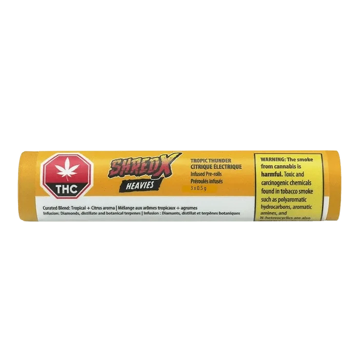 Close-up of the Tropic Thunder Heavies Infused Pre Rolled packaging, displaying bold graphics against a dark backdrop.