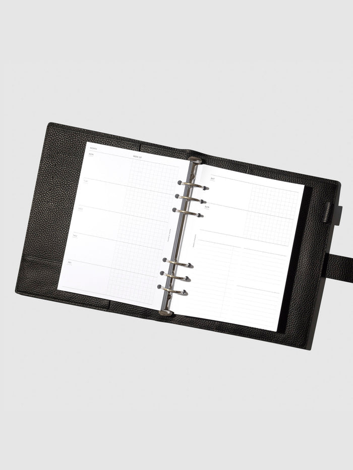Undated Horizontal Weekly Inserts in use inside a black leather planner.