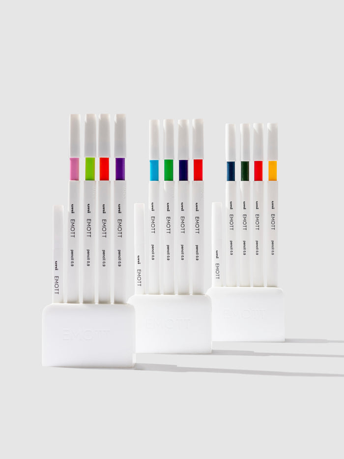 Uni Emott Colored Pencil Set, Cloth and Paper. Three sets of pens displayed on a neutral background.