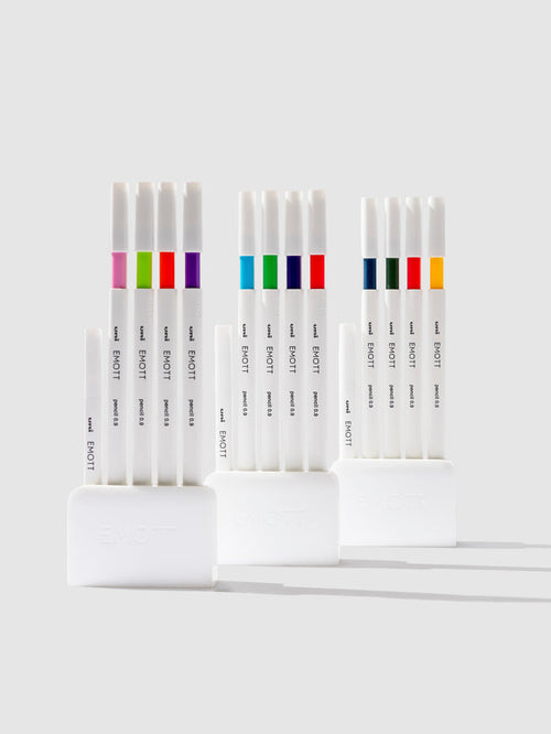 Uni Emott Colored Pencil Set, Cloth and Paper. Three sets of pens displayed on a neutral background.