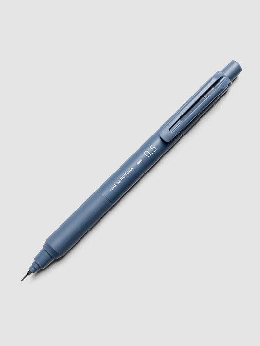 Uni Kuru Toga KS Mechanical Pencil Iron Blue laid diagonally showing clip and grip