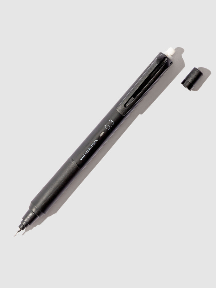 Uni Kuru Toga KS Mechanical Pencil. Black pencil displayed on a neutral background.
