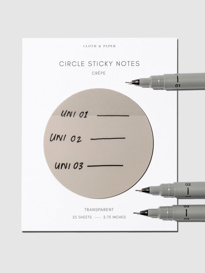 Uni Pin Marking Pen, 01, 02 and 03, Cloth and Paper. Pen resting on Sticky notes displaying writing sample.