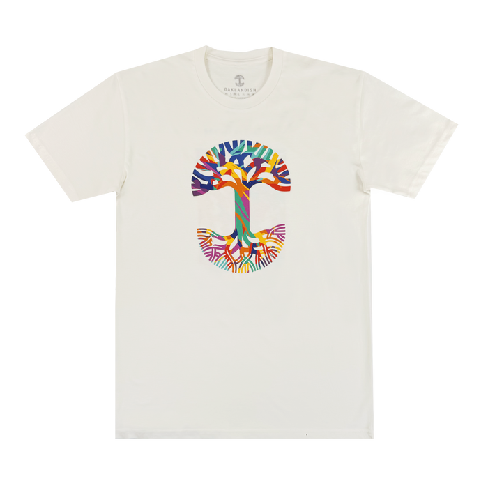The Urban Tropics Tee by Oaklandish is a white shirt with a vibrant, tree-shaped "T" design inspired by Kalani Ware, featuring colorful abstract branches and roots for an eye-catching look.