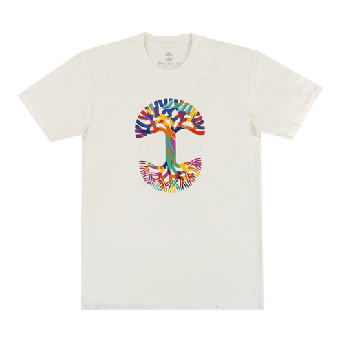 The Urban Tropics Tee by Oaklandish is a white shirt with a vibrant, tree-shaped "T" design inspired by Kalani Ware, featuring colorful abstract branches and roots for an eye-catching look.