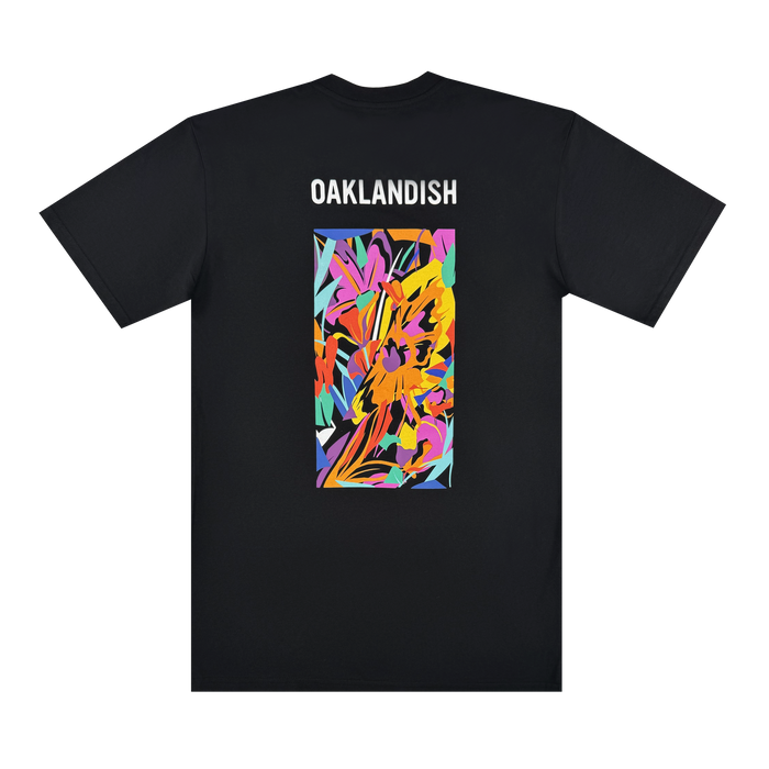 The Urban Tropics Tee by Oaklandish is a black t-shirt with "OAKLANDISH" in white near the top and Oakland artist Kalani Ware’s colorful, abstract rectangle design—featuring yellow, orange, pink, purple, blue, and green—on the back.