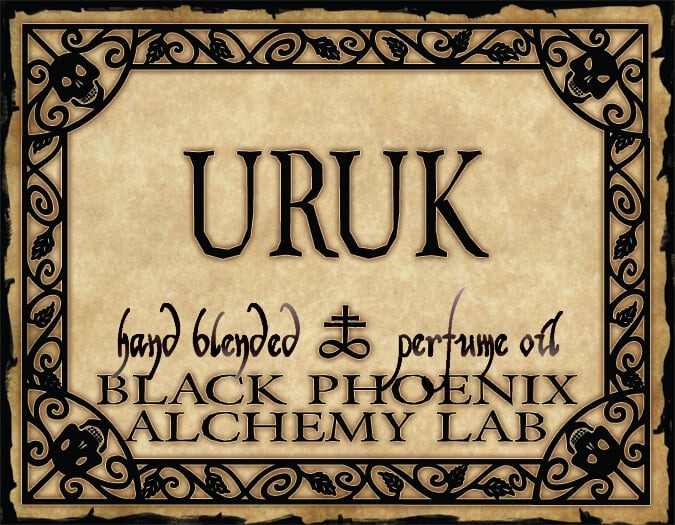 Label for Uruk perfume oil by Black Phoenix Alchemy Lab with decorative border and text.