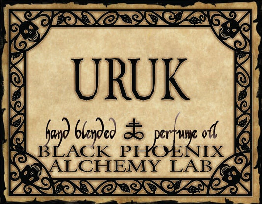 Label for Uruk perfume oil by Black Phoenix Alchemy Lab with decorative border and text.