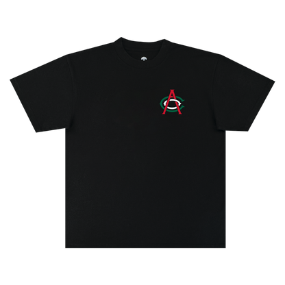 The OAC Viva OAC Tee is a black, short-sleeve classic fit t-shirt crafted from heavyweight cotton. It features a subtle design on the left chest: a small red “A” overlapping a green “C” inside a white oval—a nod to the Oakland Athletic Club—set against an otherwise plain black background, with no additional graphics or text.