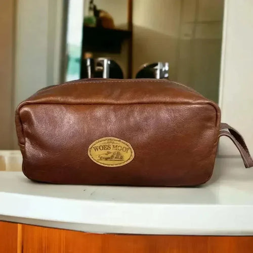 Light brown genuine leather shaving bag by Woesmooi, compact travel toiletry pouch